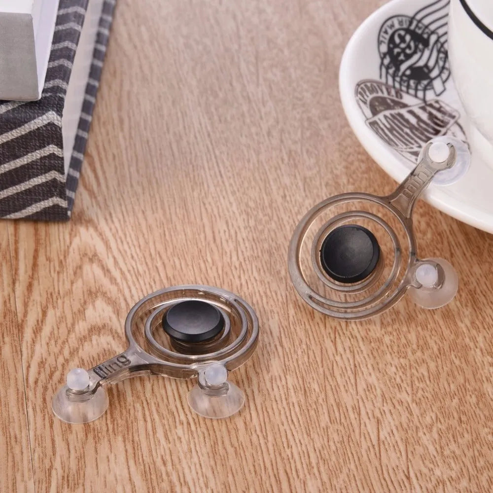 Pair of clear plastic mini joysticks for mobile phone and tablet touch screen gaming.