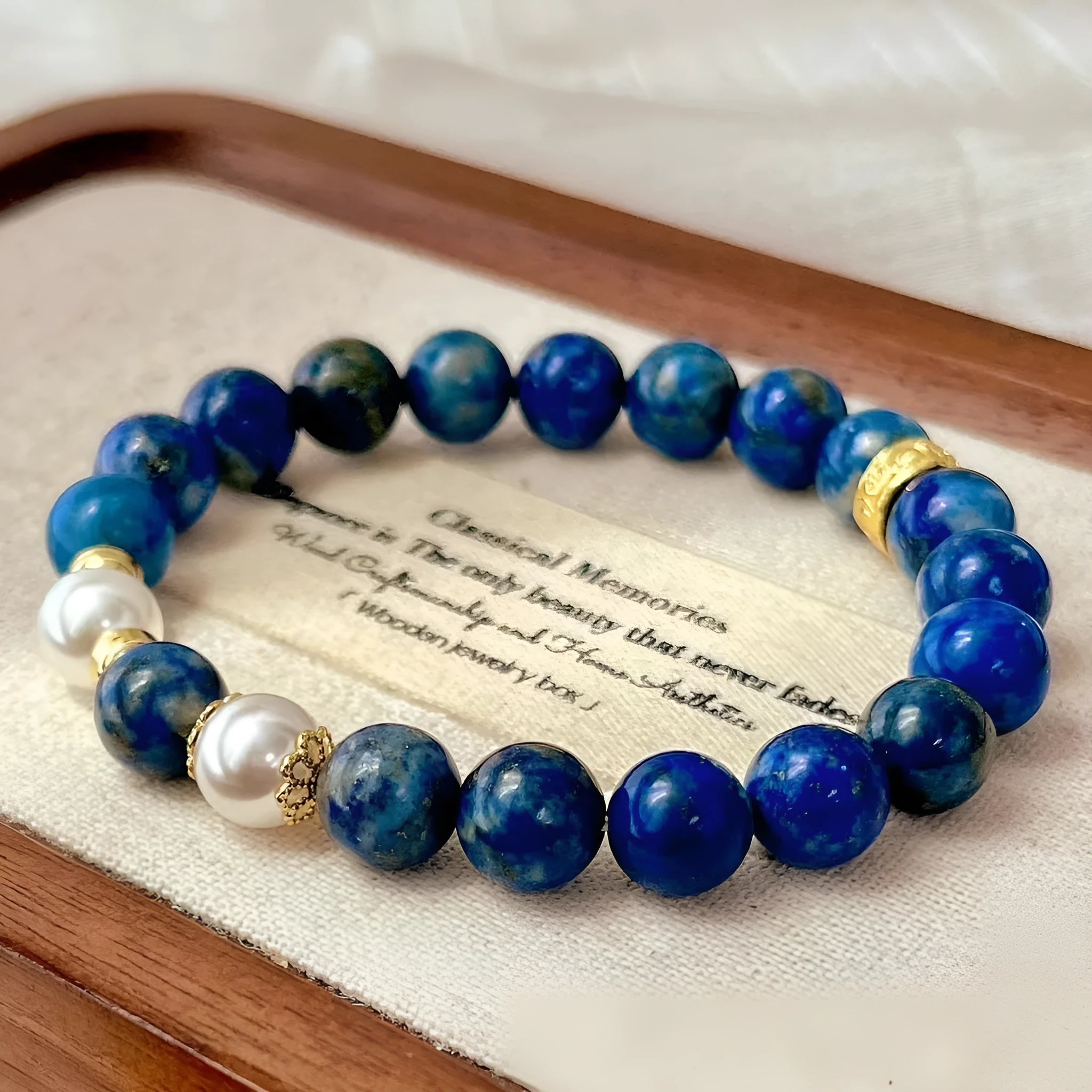 Chinese style lapis lazuli bracelet with green gold stone elements and artistic retro design