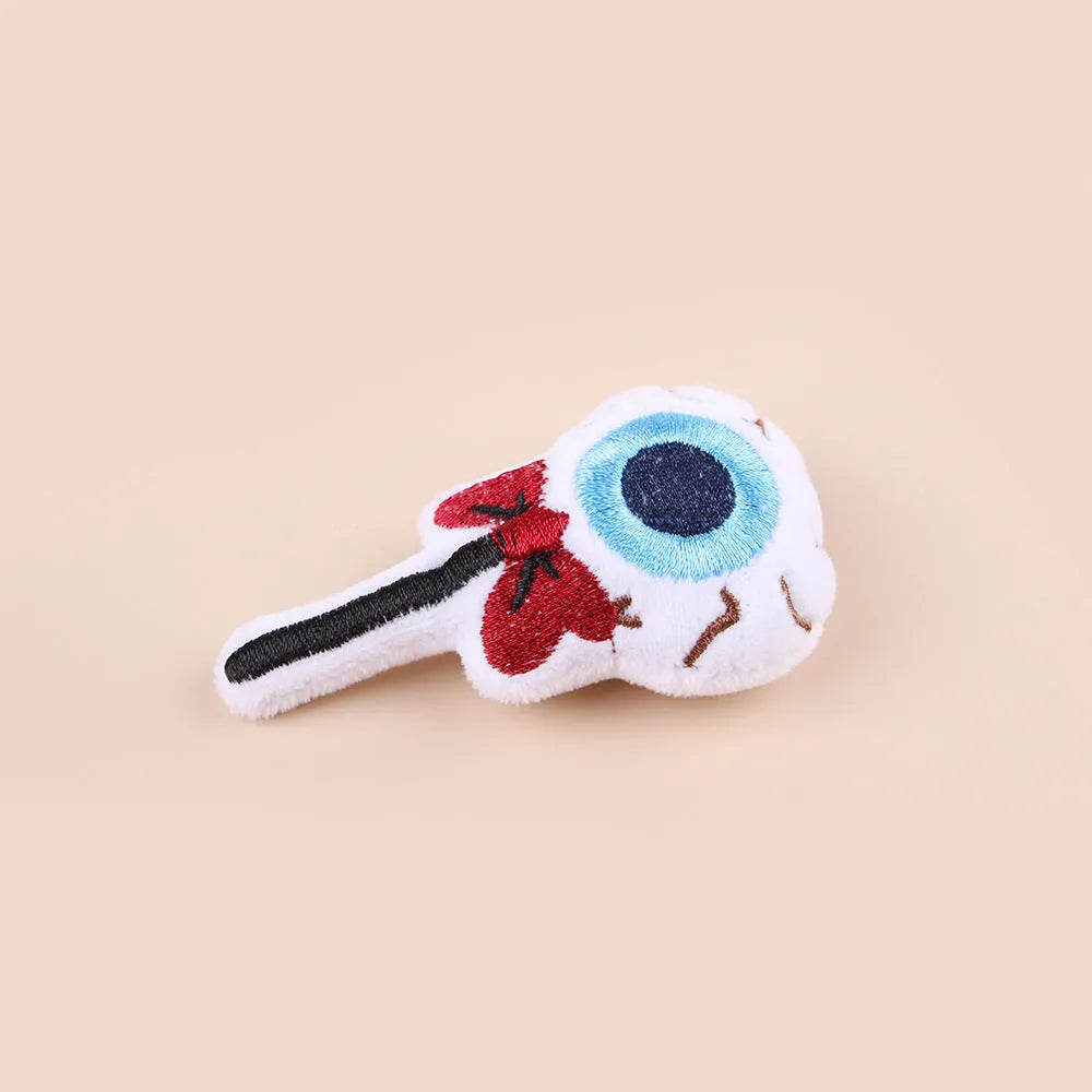 Small plush cat teaser toy with candy, eyes or skull design and feather attachment
