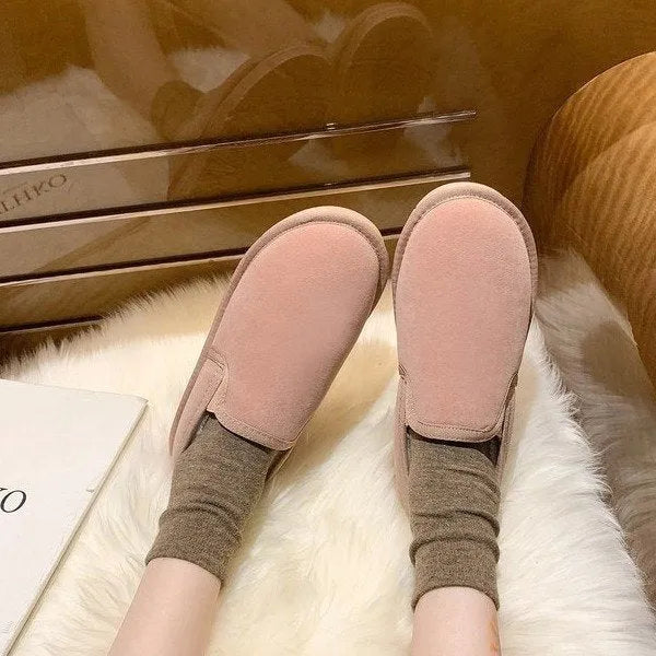 Fleece-lined flat snow boots with round toe design and rubber soles in multiple colour options