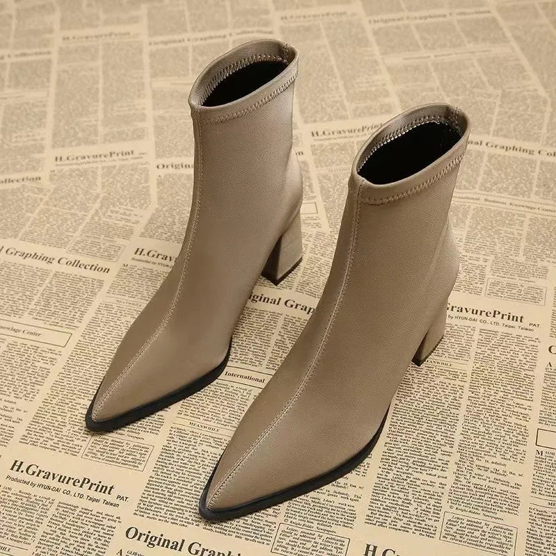 Women's khaki stretch suede pointed toe ankle boots with wedge heels on white background