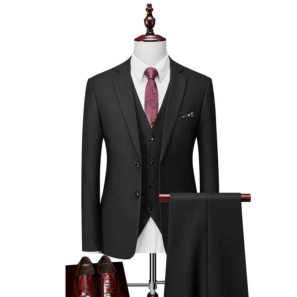 Men's navy blue plaid slim fit three-piece suit with jacket, vest, and trousers on hanger