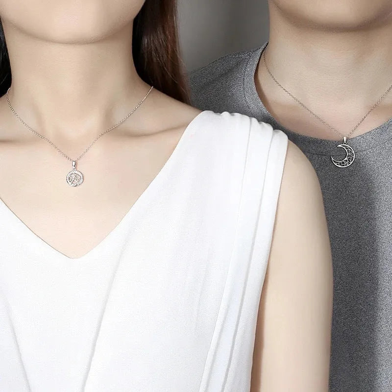 Copper sun and moon tooth couple necklace set with electroplated finish on a cross chain.