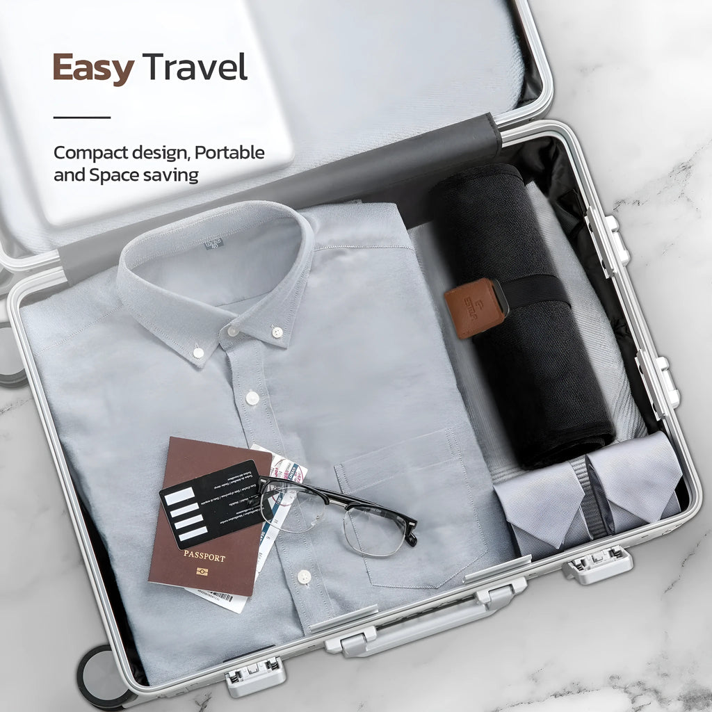 Men's black portable PU travel wash bag with toiletry items inside.