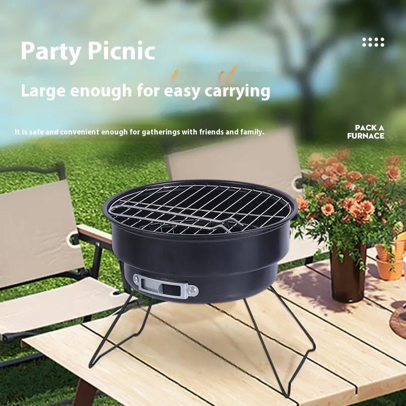 Small metal round folding ice stove with grill mesh and legs set up for barbecue.