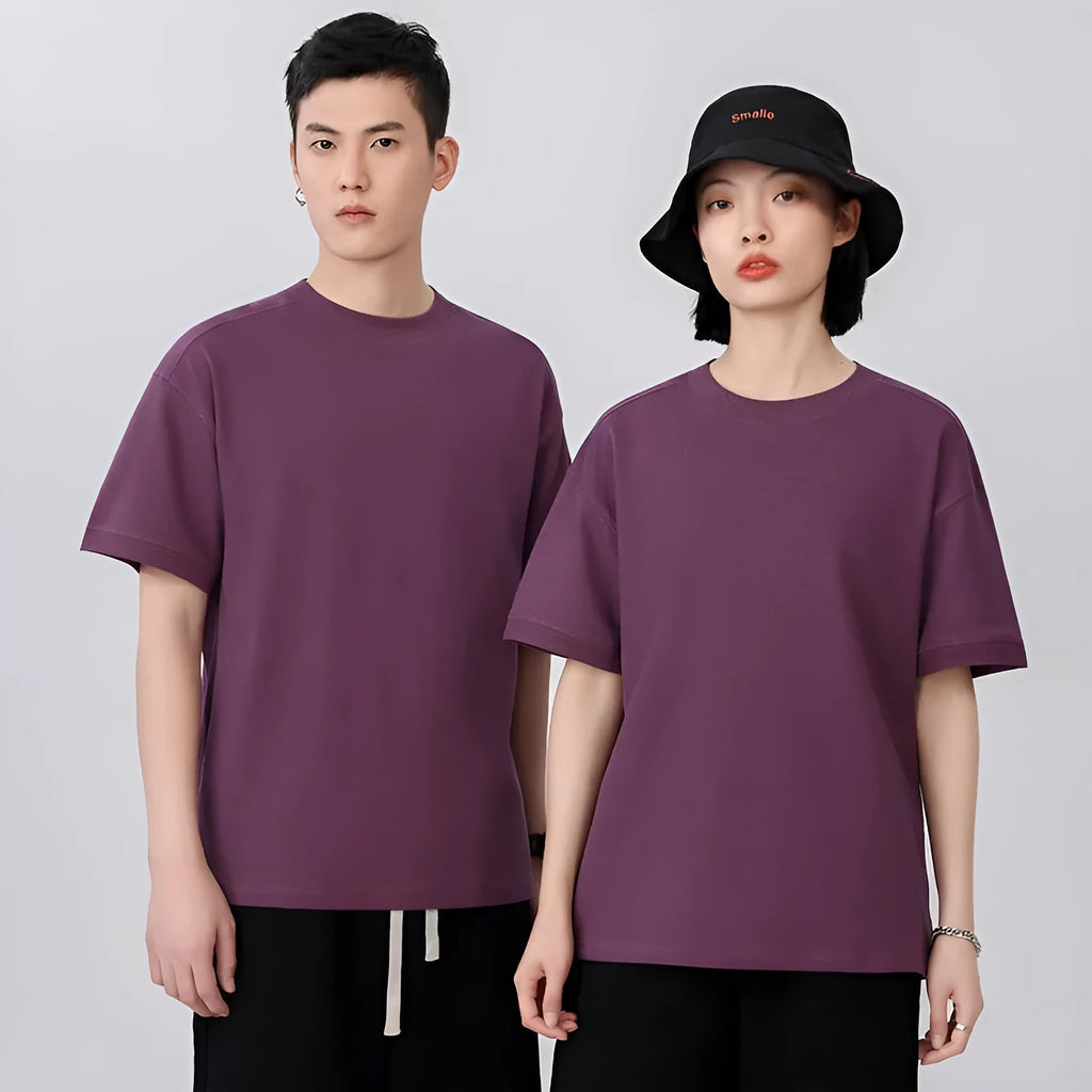 Man wearing a light grey pique cotton short sleeve t-shirt with a loose fit.