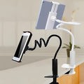 Flexible mount holder with bendable arm and suction base holding tablet at angle