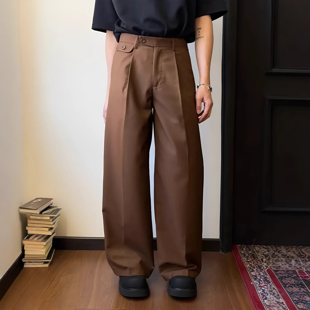 Brown men's wide-leg straight trousers with a draping casual suit style on a hanger.