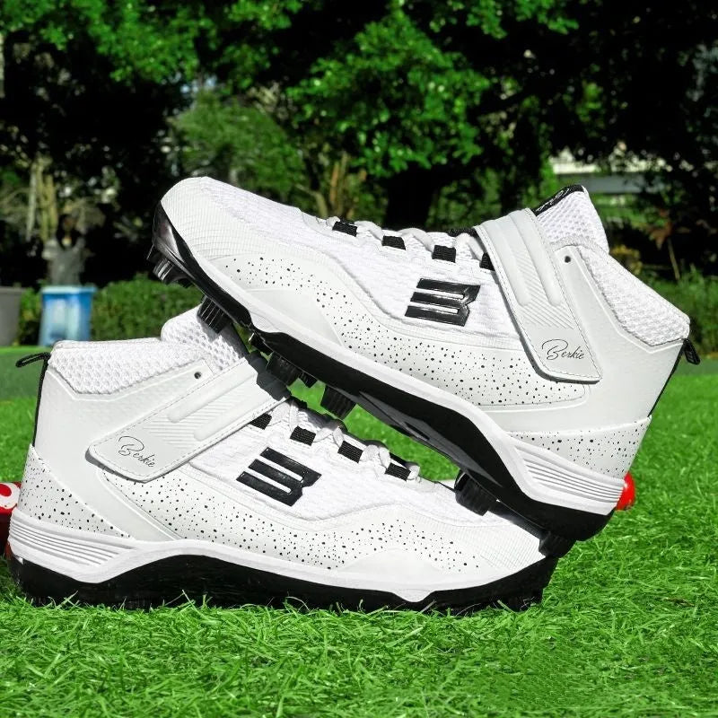 Black and white mid-top sports sneakers with velcro straps and a rubber sole.
