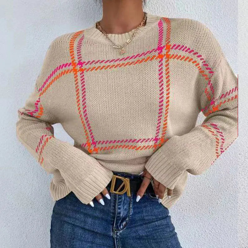 Women's loose fit crew neck sweater in a colour-block plaid pattern with apricot, black, beige, red, and green stripes.