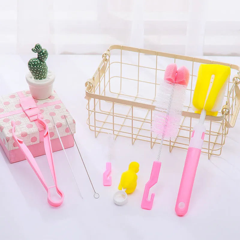 Orange Belle seven-piece bottle brush set in blue and pink includes sponge brush, nylon brush, nipple brushes, straw brushes, and bottle holder