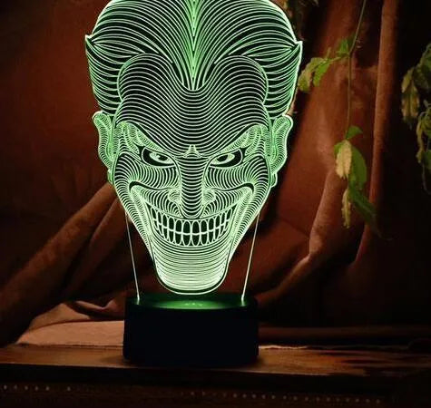 USB-powered 3D acrylic LED lamp displaying multiple colours, shown with its remote control and stand.