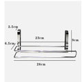 Silver stainless steel kitchen towel rack hanging on a cabinet door.