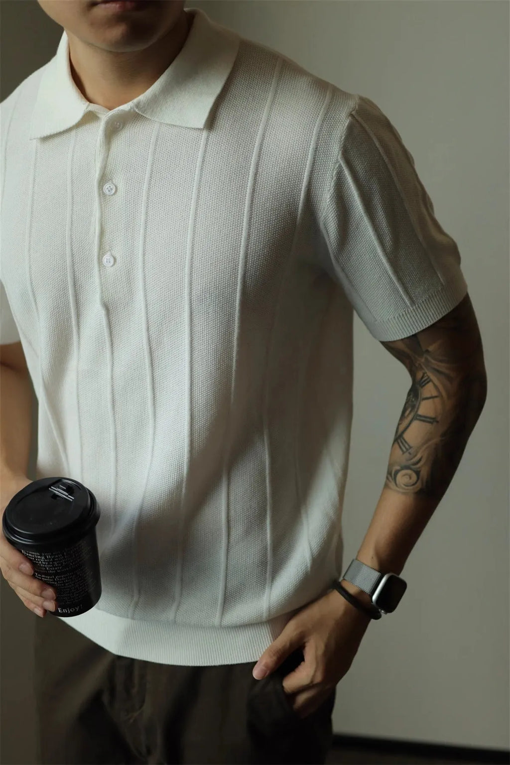 Men's solid black loose fit t-shirt on a hanger