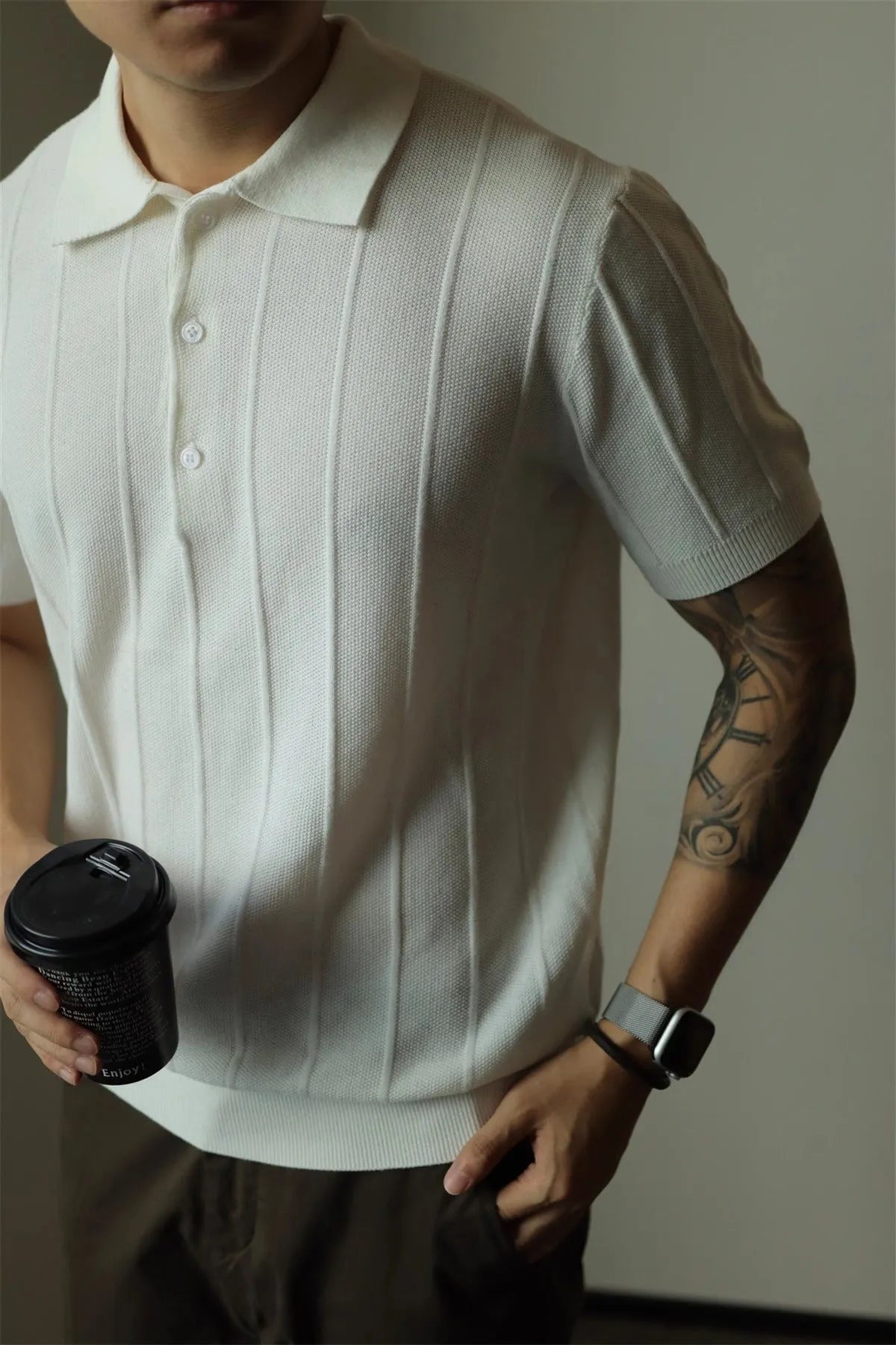 Men's solid black loose fit t-shirt on a hanger
