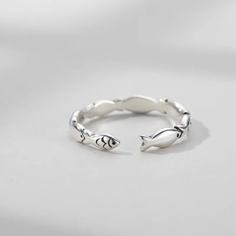 Women's adjustable sterling silver fish ring with carp zodiac design and open mouth sizing