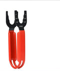 Orange coloured steel pipe wrench with an adjustable jaw on a plain background.