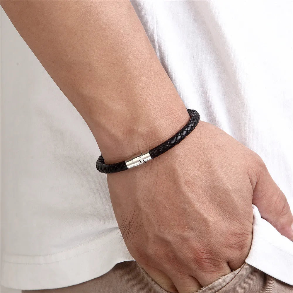 Titanium steel wire bracelet with magnetic clasp in a geometric line design on a wrist.