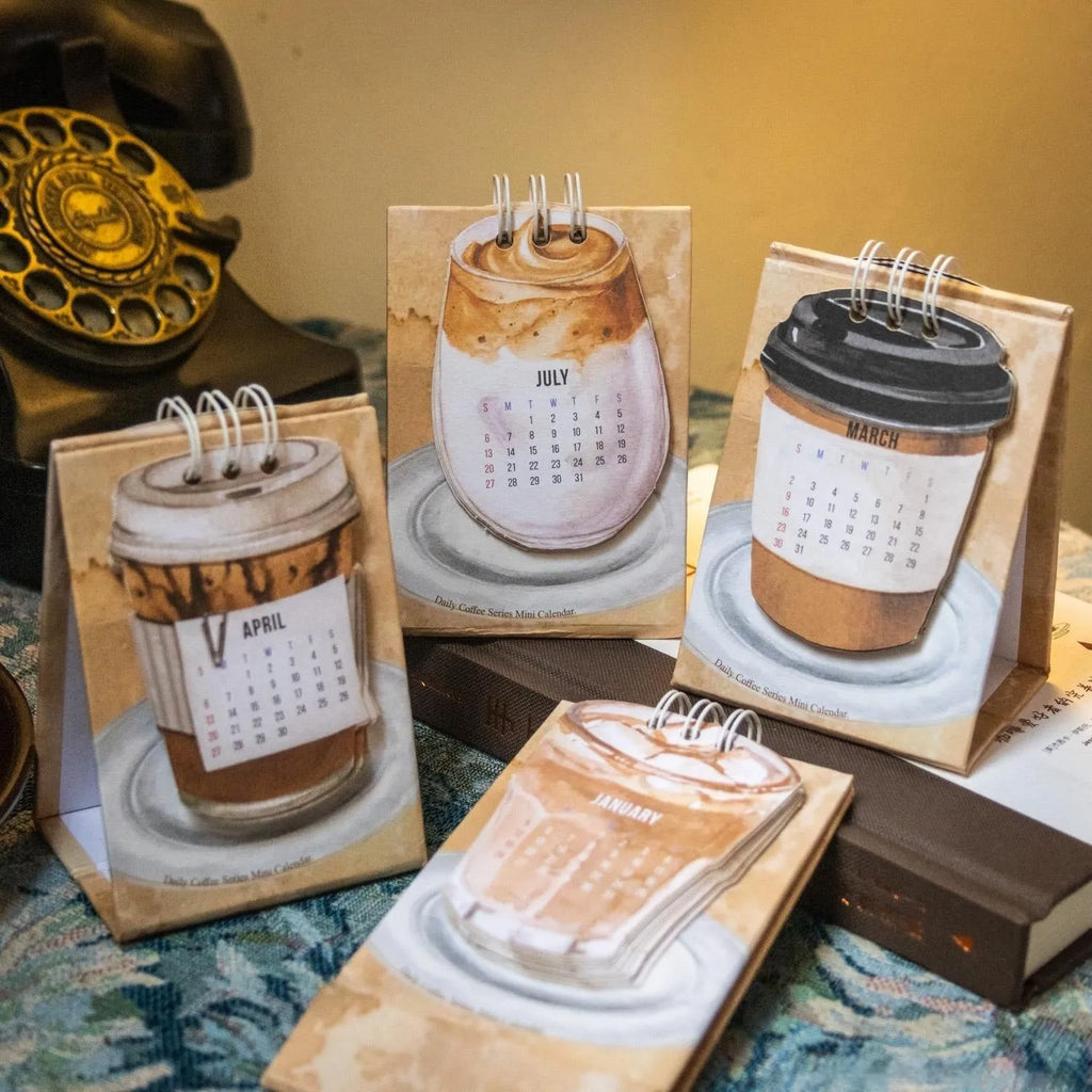 Coffee Coffee mini desk calendar set showing four 2025 paper calendars with different themes for daily inspiration