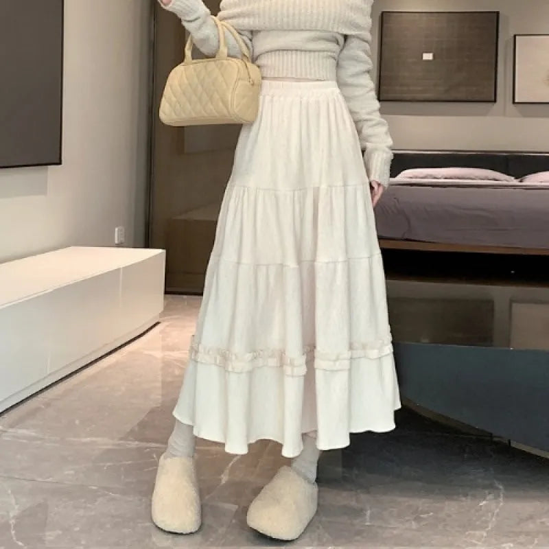 Women's corduroy A-line midi skirt with elastic waistband in milky white, black, or brown colours