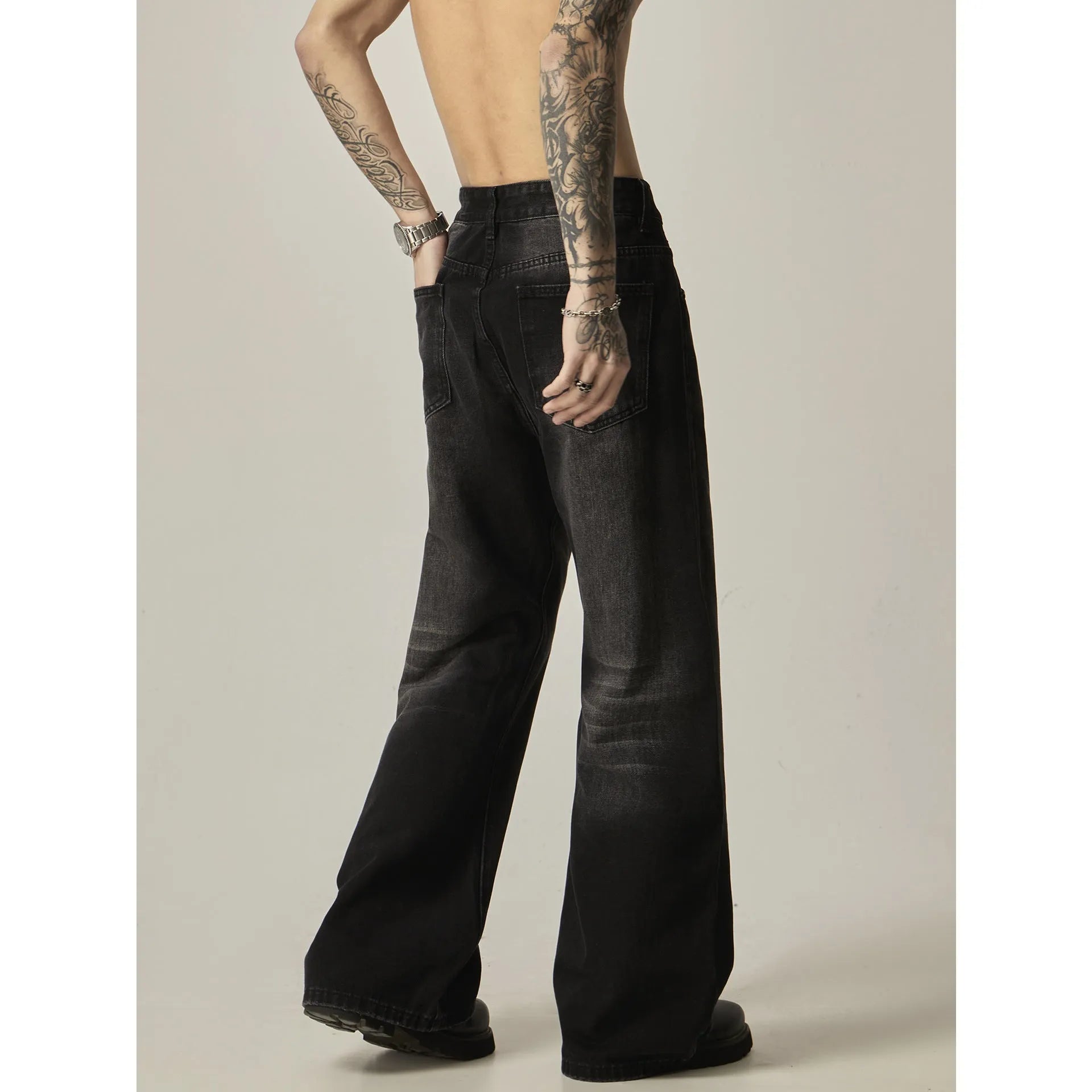 Black loose straight leg jeans with American retro styling and zipper fly front.