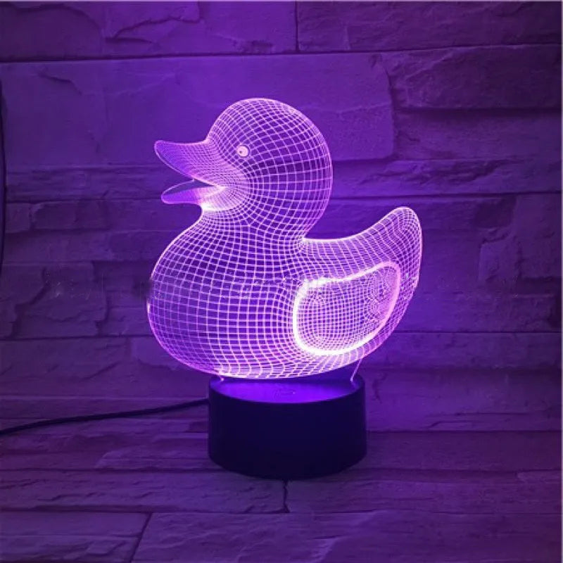 Little yellow duck 3D night light on table showing multiple colour options