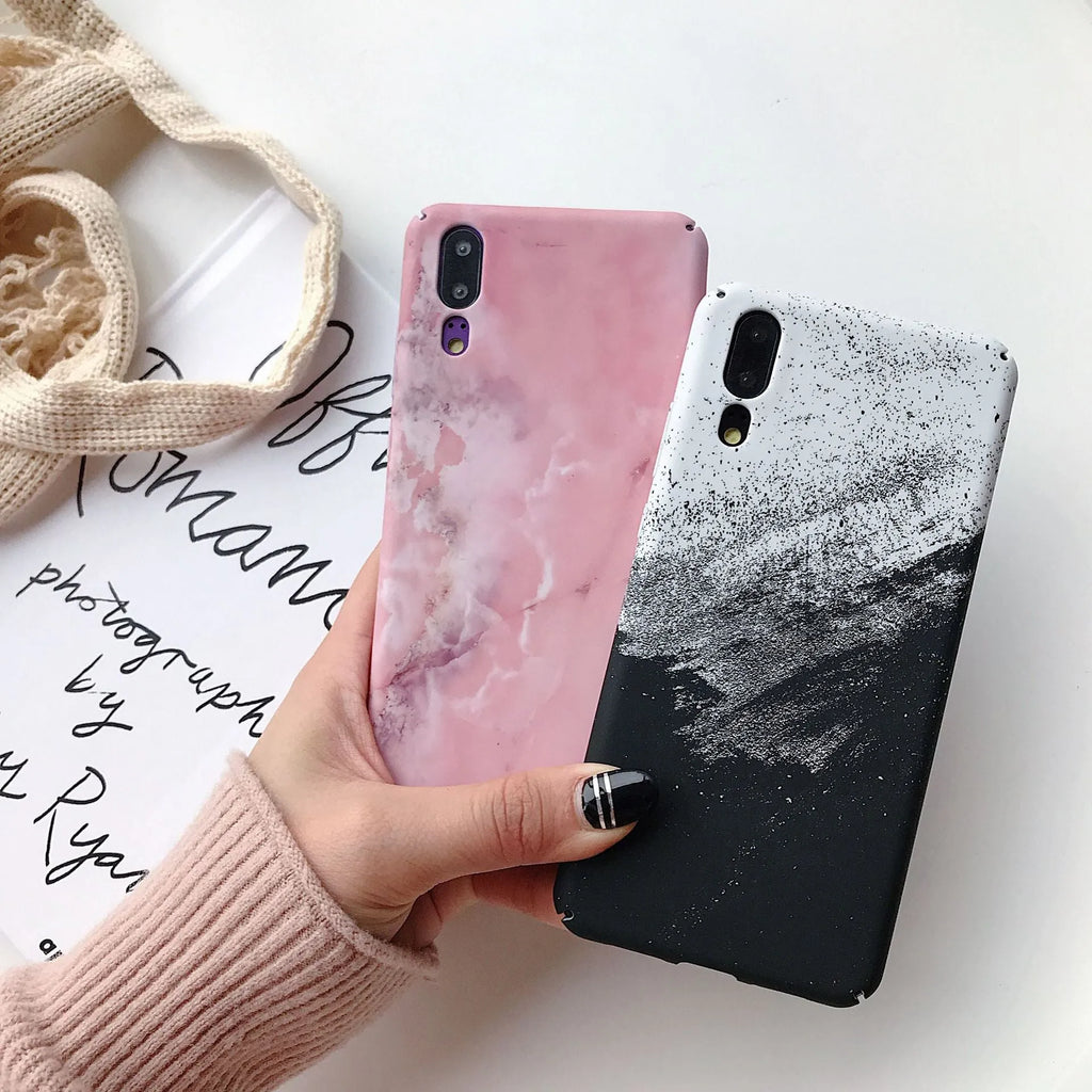 Black painted polycarbonate back cover case for a Huawei smartphone on a white background.