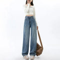 Retro blue high-waist wide-leg jeans for women on a hanger.