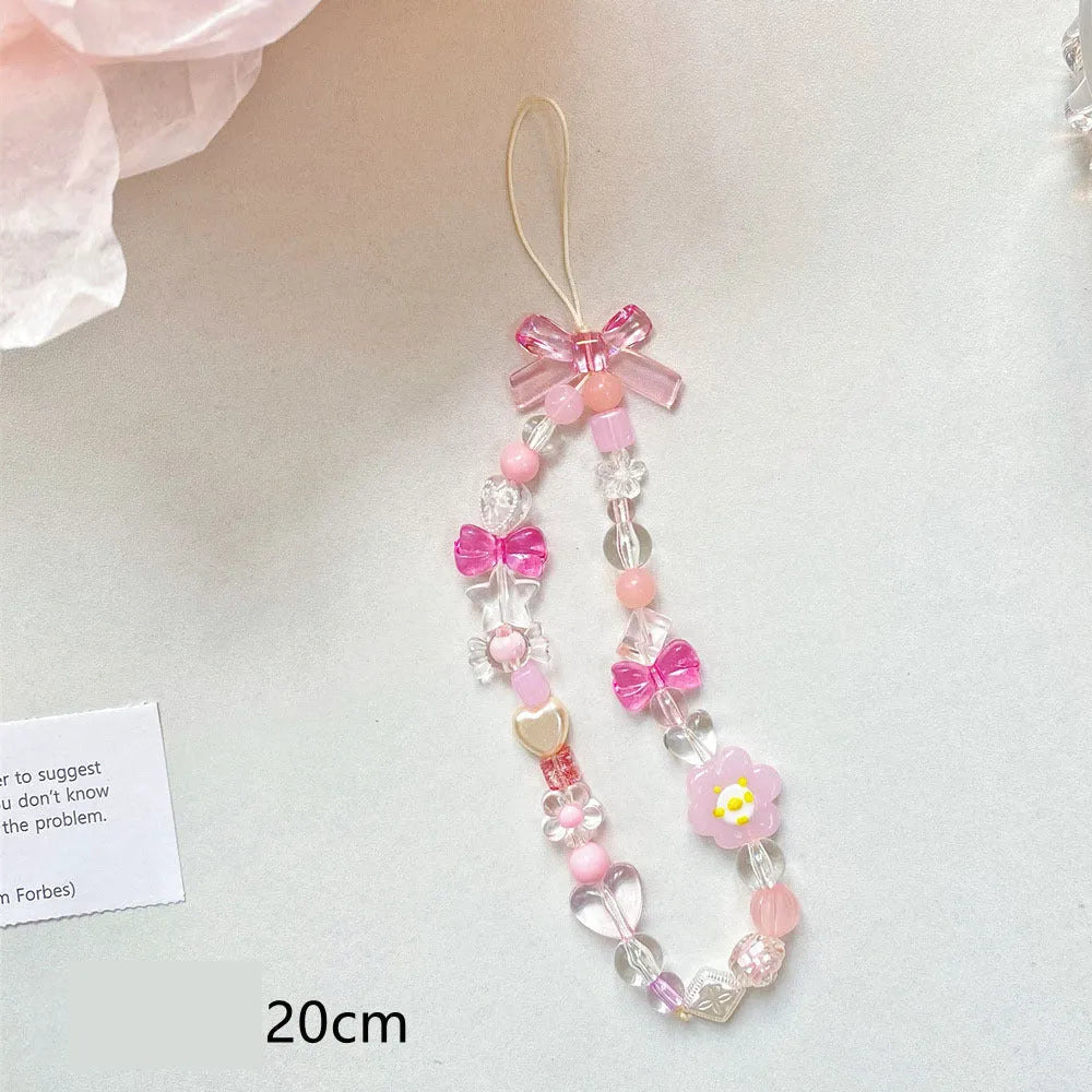 Beaded flower mobile phone lanyard with hand rope design in yellow, blue, or pink colour options