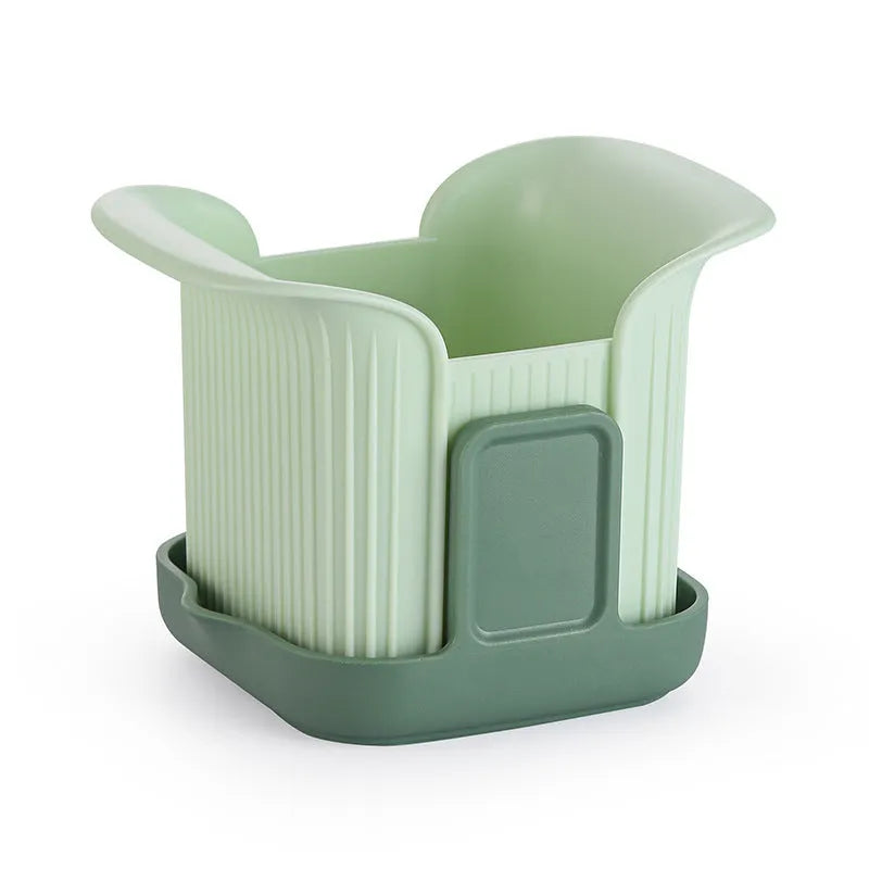 Green hand-operated vegetable chopper with stainless steel blades for slicing onions, potatoes, radishes and cucumbers