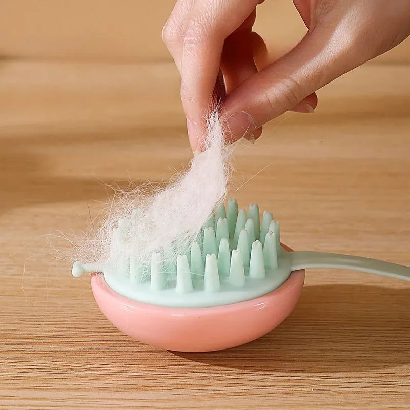 Blue silicone pet bathing brush with soft nubs for massaging and cleaning cats or dogs.