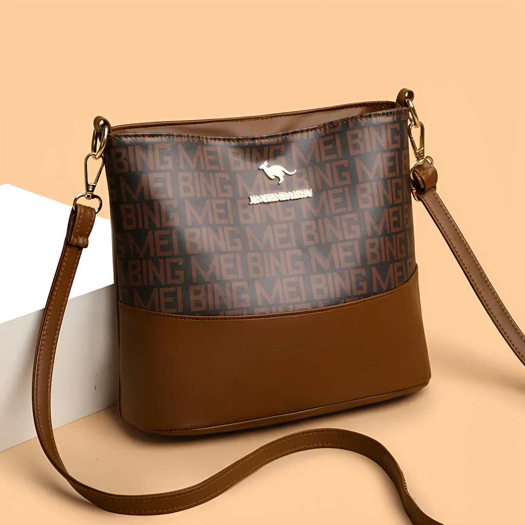 Brown soft leather messenger bag showing three-dimensional pocket and internal organisation compartments