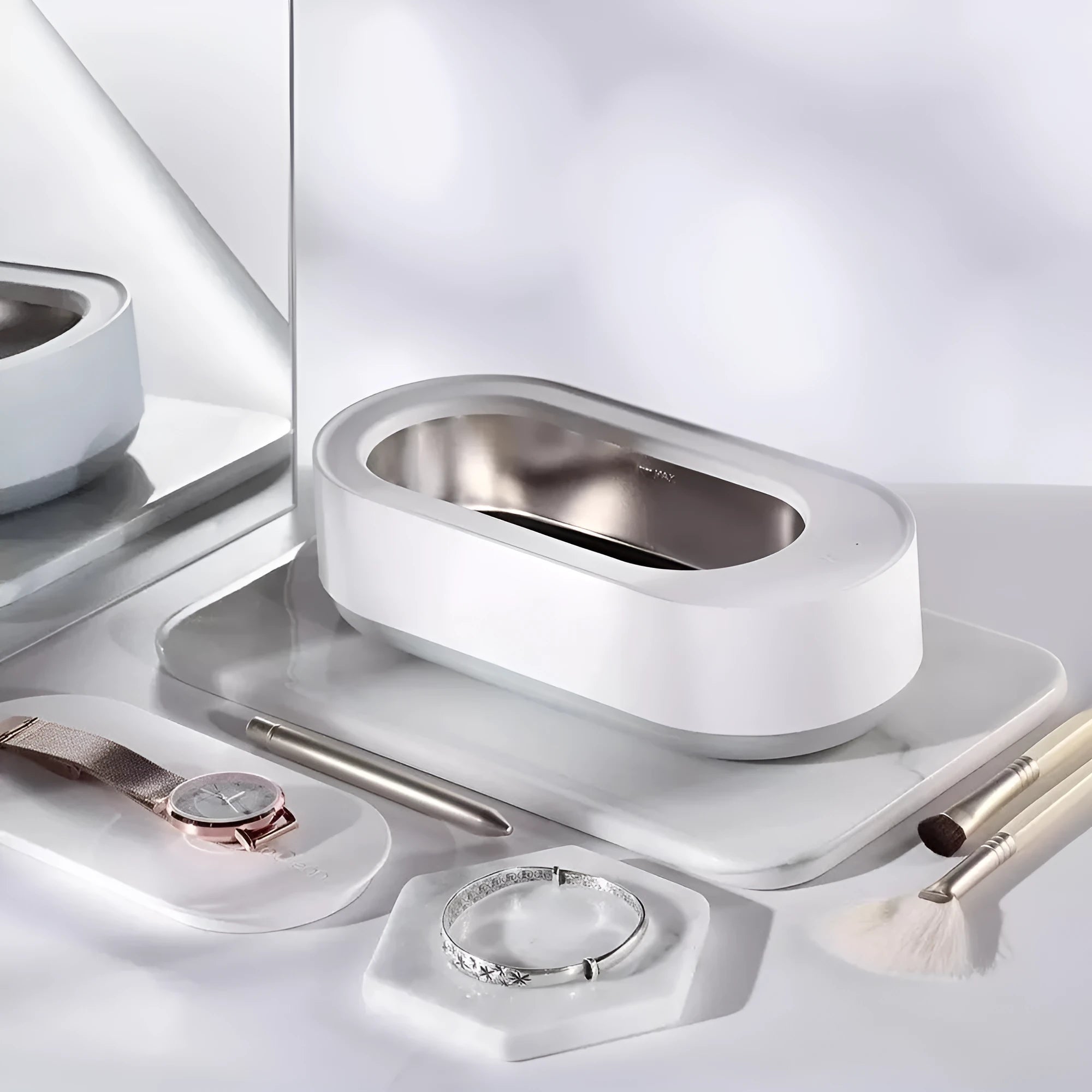 White portable ultrasonic cleaner with stainless steel tank and touch button.