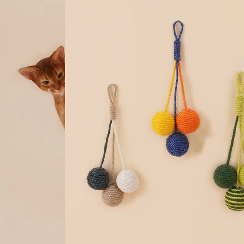 Cat toy set with blue teaser stick and multicoloured catnip ball on white background