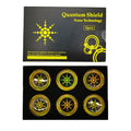 Pack of six gold and silver anti-radiation mobile phone stickers on a white background.