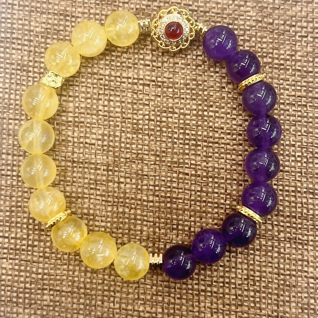 Handmade women's yellow and purple bracelet with amethyst and crystal beads featuring adjustable sliding knot closure