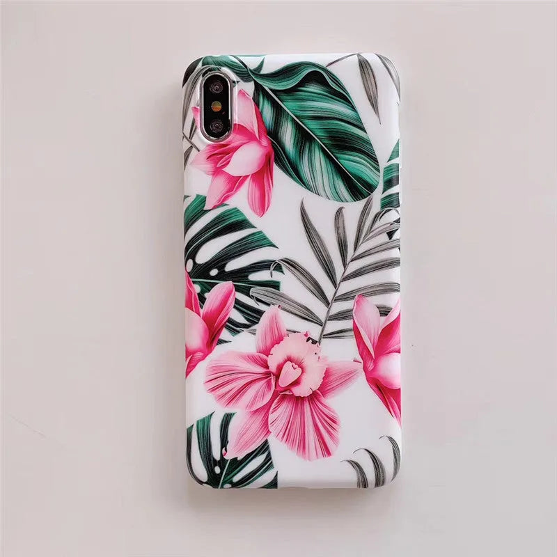 Pink floral TPU phone case for iPhone models on a table