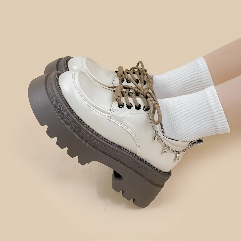 White platform leather shoes with chunky heel and round toe in British style