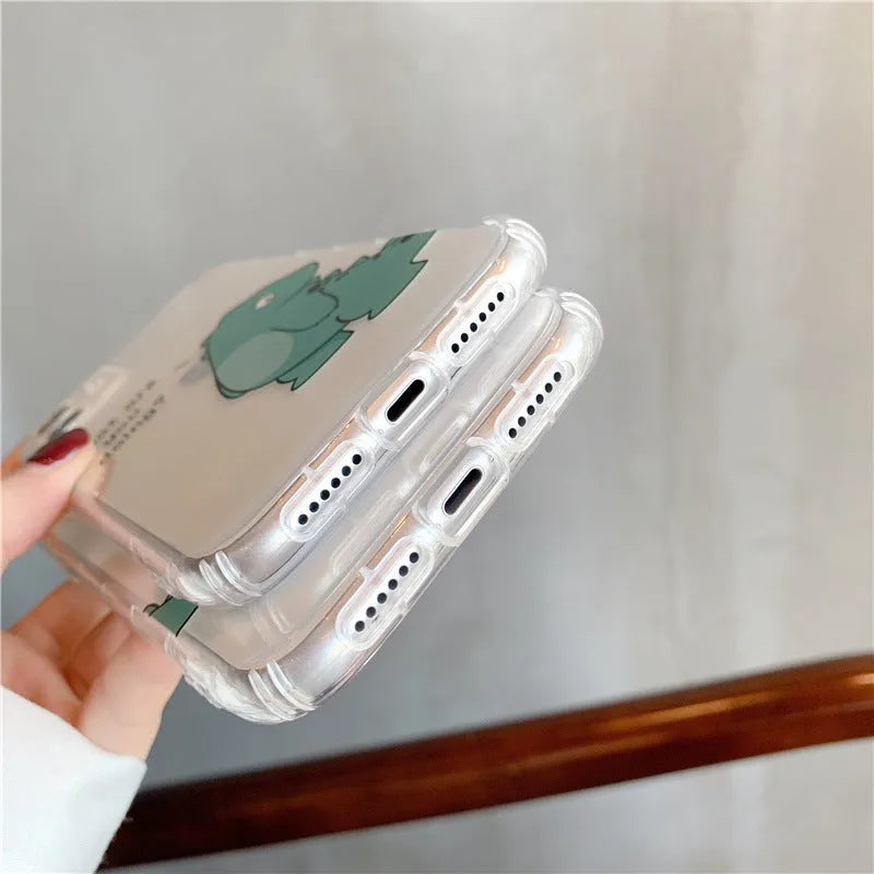 Transparent airbag shockproof mobile phone case for iPhone with green dinosaur design on clear back.
