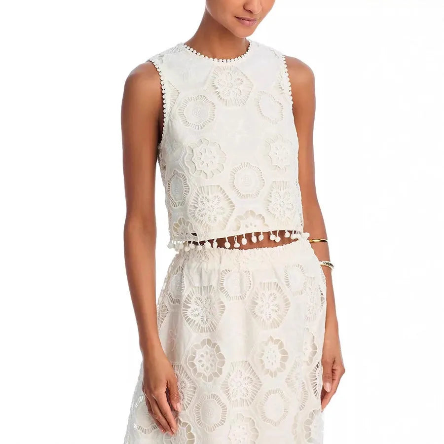 White women's two-piece suit with sleeveless top and embroidered long skirt