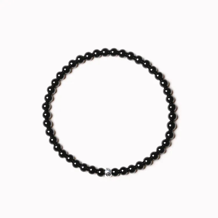 Fine unisex bracelet with blue San, black agate, and obsidian beads in a geometric 4mm design.