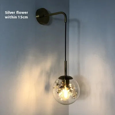 Modern glass wall lamp in golden flower finish with LED bedside lighting
