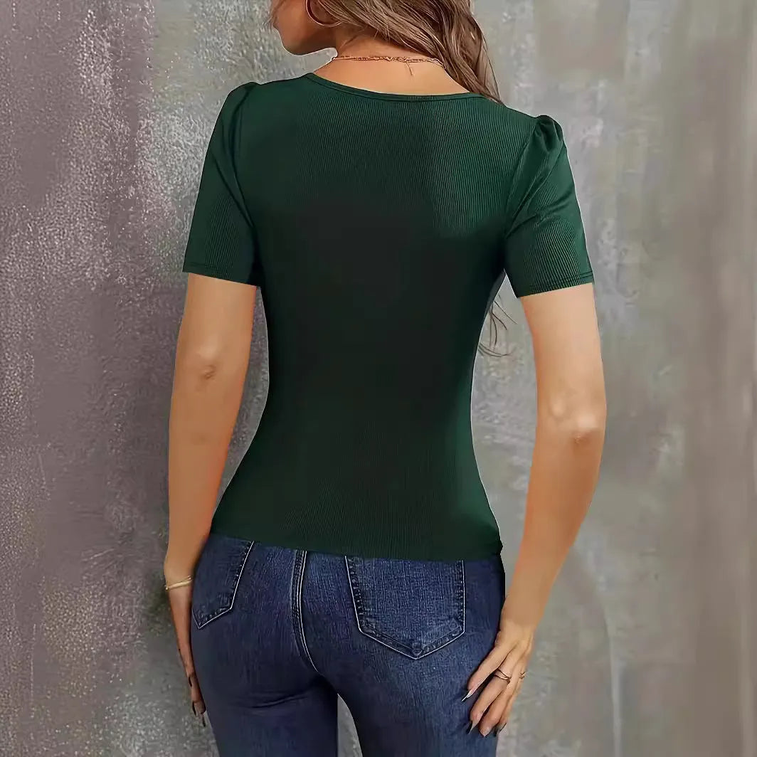 Women's wine red knitted short sleeve top with low neckline and slim fit on mannequin