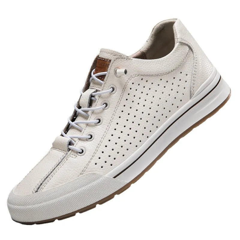 Men's white and black leather round toe flat casual trainers on a plain background.