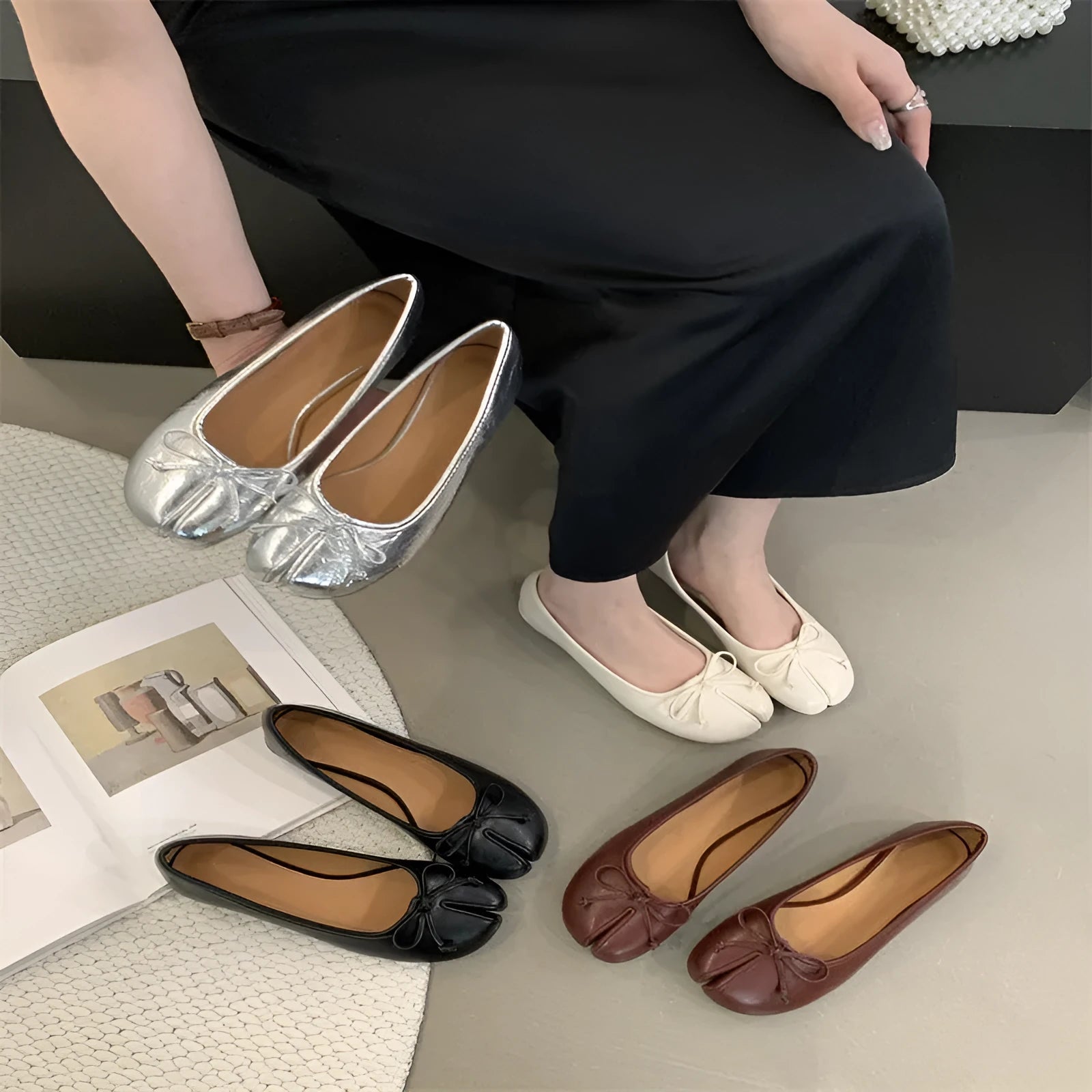 Women's split-toe flat pump shoes in beige with a round toe and shallow cut.