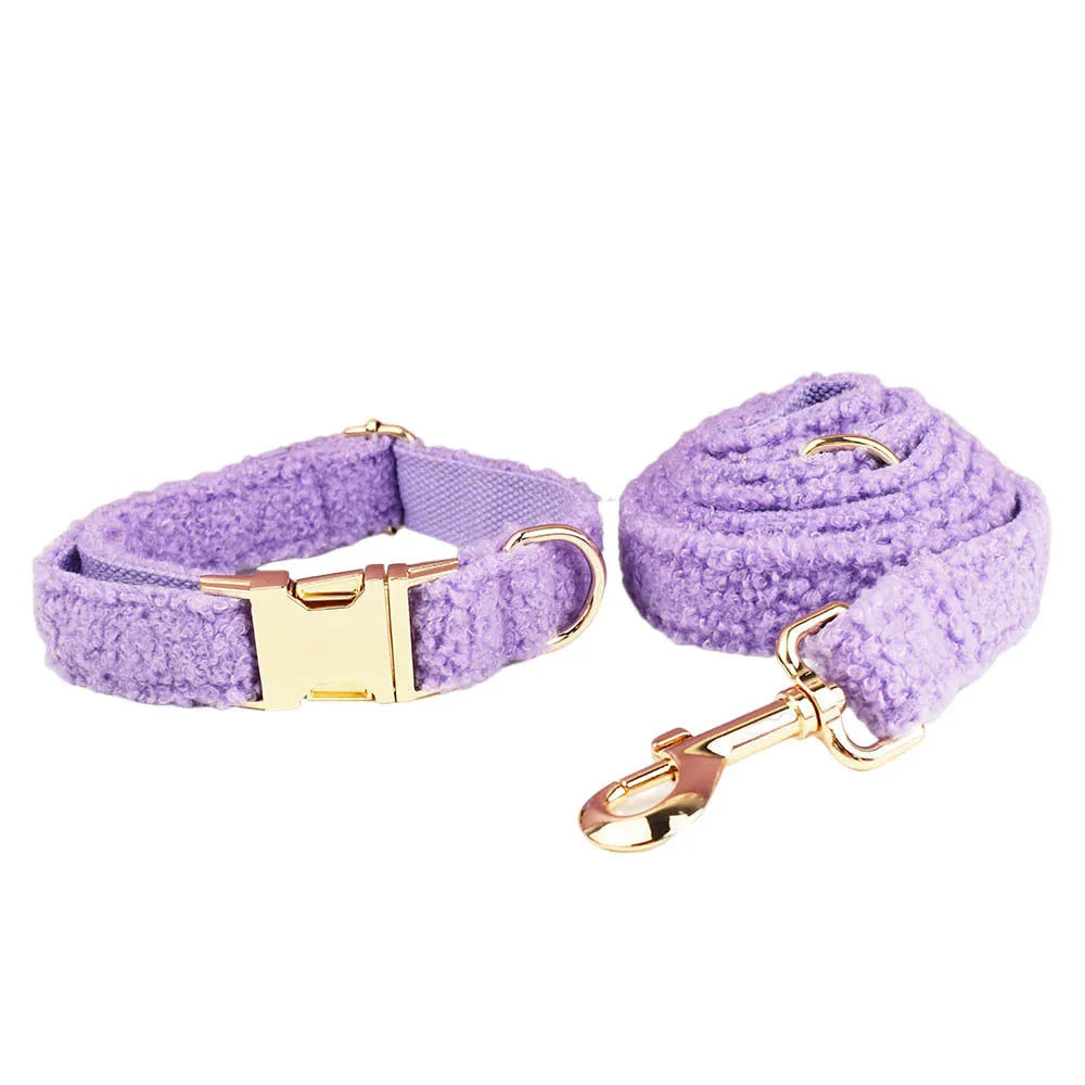 Purple cloth dog collar, leash, vest and bow four-piece pet accessory set showing coordinated design
