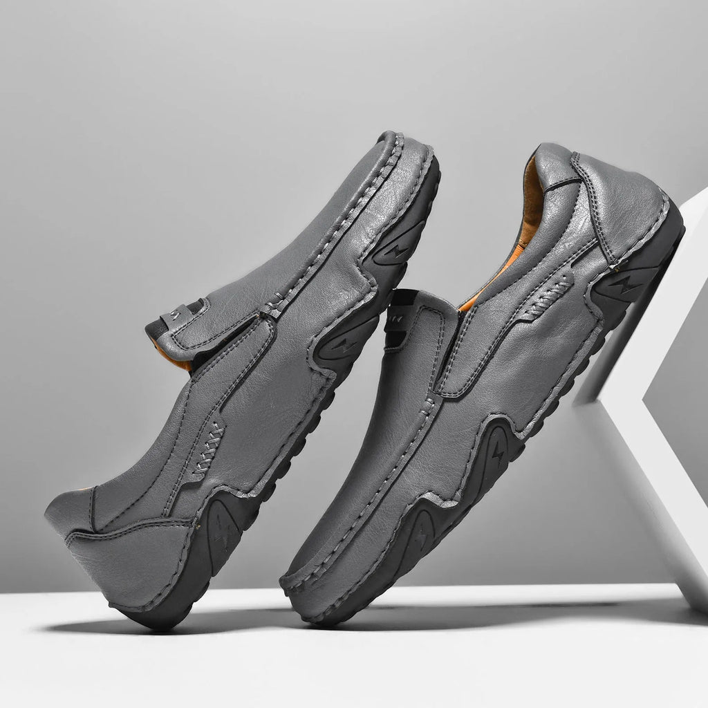Men's leather slip-on casual shoes with round toe and flat rubber sole in four colour options
