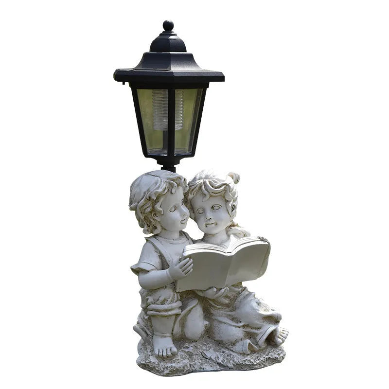 Hexagonal solar garden lamp with decorative resin animal design on grass