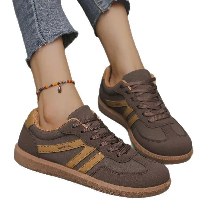 Women's retro casual sneaker in a wine red colour with a round toe, flat rubber sole, and front lace-up fastening.