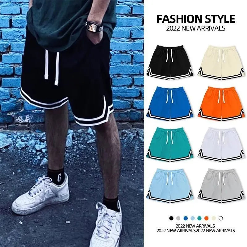 Men's loose fit polyester sports shorts in various colours on a size chart background